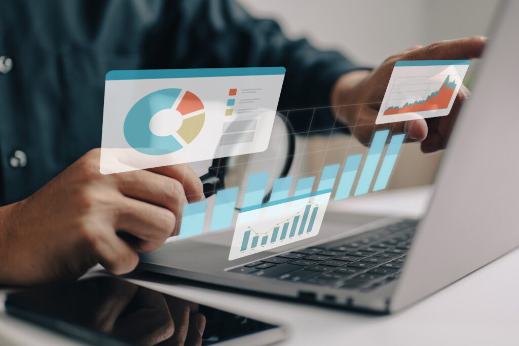 Businesspeople working on a monitor graph dashboard while performing statistical and data analysis for corporate finance and investment ideas.